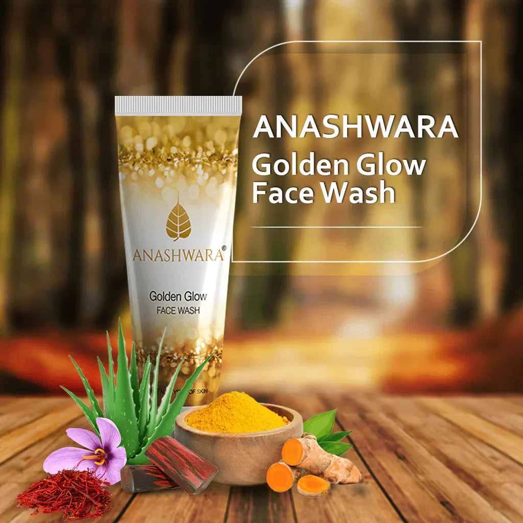 Anashwara Golden Glow Face Wash tube on wooden surface with turmeric, aloe vera, and flower ingredients